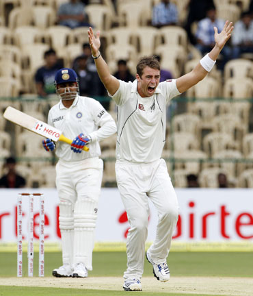 New Zealand's Tim Southee (R) appeals unsuccessfully for the wicket of India's Virender Sehwag
