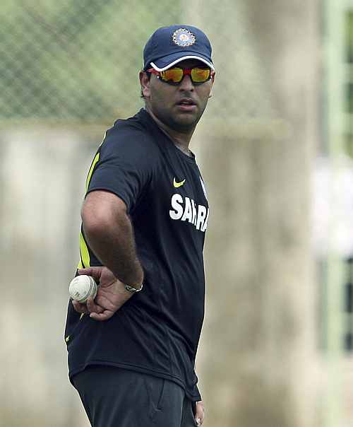 India's Yuvraj Singh holds a ball while standing in the nets during a practice session ahead of their first Twenty20 cricket match against New Zealand in Visakhapatnam
