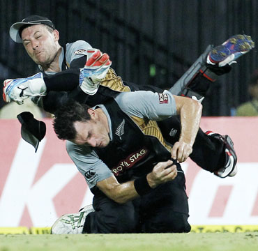 New Zealand's wicketkeeper Brendon McCullum (top) collides with teammate Kyle Mills as he attempts to take a catch to dismiss India's Yuvraj Singh during their second Twenty20 cricket match in Chennai