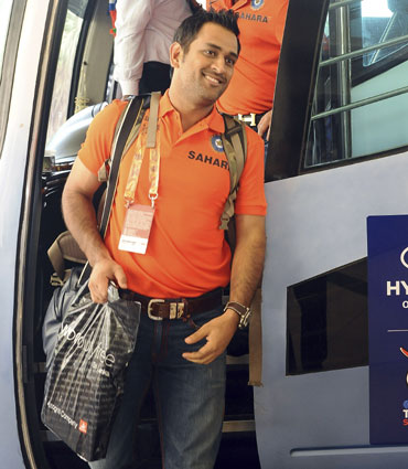 India's captain Mahendra Singh Dhoni (front) arrives at a hotel ahead of the World Twenty20 cricket series in Colombo