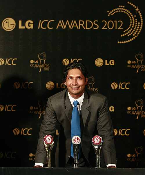 Sri Lanka's Kumar Sangakkara poses with his trophies during the ICC Awards in Colombo