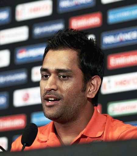 India's captain Mahendra Singh Dhoni speaks to reporters