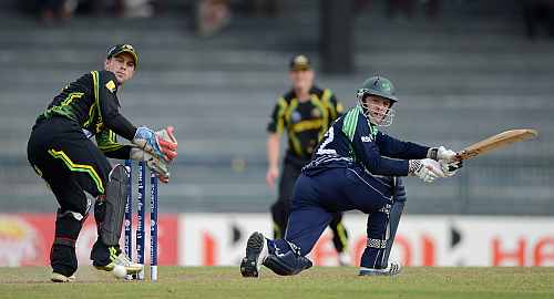 Niall O'Brien of Ireland hits past Australia wicketkeeper Matthew Wade