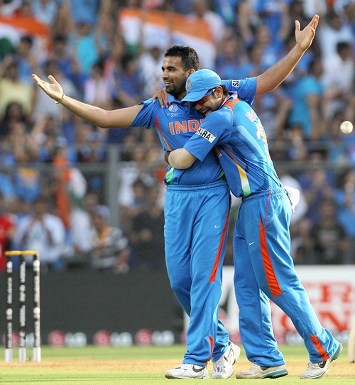 Zaheer Khan (left) of India celebrates with teammate Virat Kohli