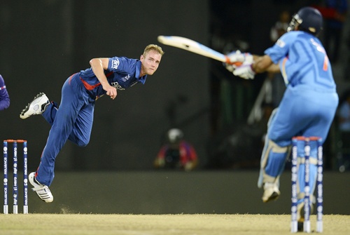 England's captain Stuart Broad (centre) bowls to India's captain Mahendra Singh Dhoni