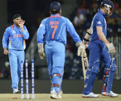 India's Harbhajan Singh (left) gestures after dismissing England's Graeme Swann (right)