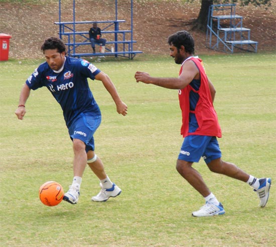 Sachin Tendulkar plays football with team mate Ambati Rayudu