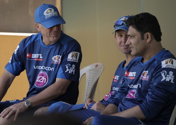 Mumbai Indians coach John Wright (left) speaks to captain Ricky Ponting and chief mentor Anil Kumble