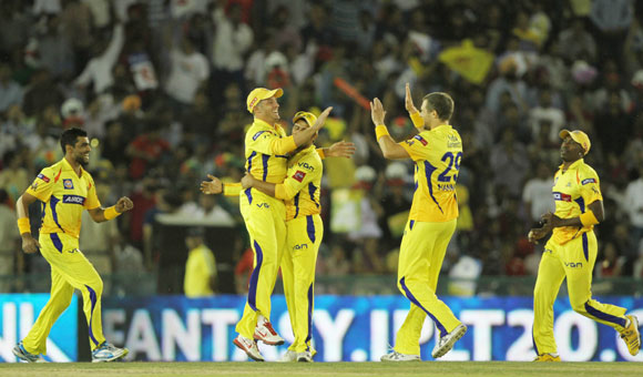 Chennai Super King players celebrates the wicket of Kings XI Punjab captain Adam Gilchrist