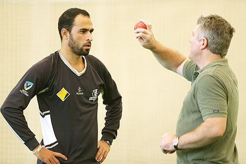 Former Australia cricket player Stuart MacGill (right) chats to Victorian player Fawad Ahmed