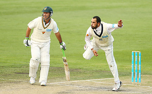 Ricky Ponting of Tasmania backs up as Fawad Ahmed of Victoria bowls