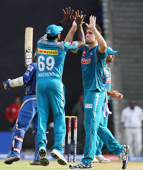 Mitchell Marsh celebrates after picking Karthik's wicket