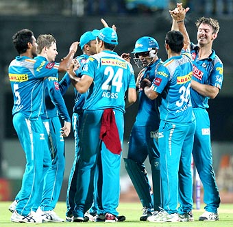 Pune Warriors celebrate the fall of a Chennai wicket
