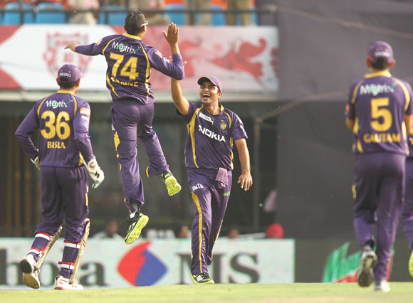 Kolkata Knight Riders player Sunil Narine is congratulated by teammates after his hat-trick
