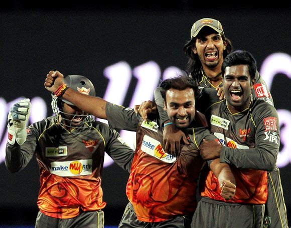 This file photograph shows Amit Mishra celebrating with team mates after getting his hat-trick and winning the match for Sunrisers Hyderabad.