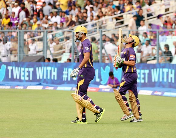 Yusuf Pathan (left) walks out to open the batting with Gautam Gambhir