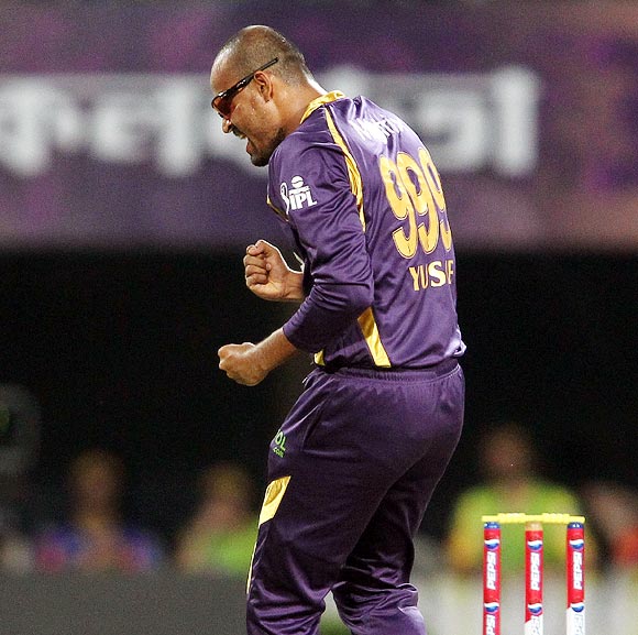 Yusuf Pathan celebrates getting the wicket of Suresh Raina