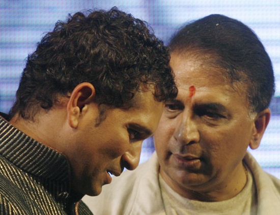 Sachin Tendulkar (left) listens to former cricketer Sunil Gavaskar