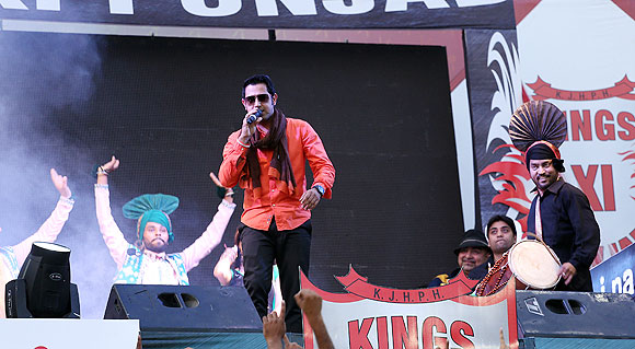 A singer performs before the match between The Kings XI Punjab and the Pune Warriors in Mohali on Sunday