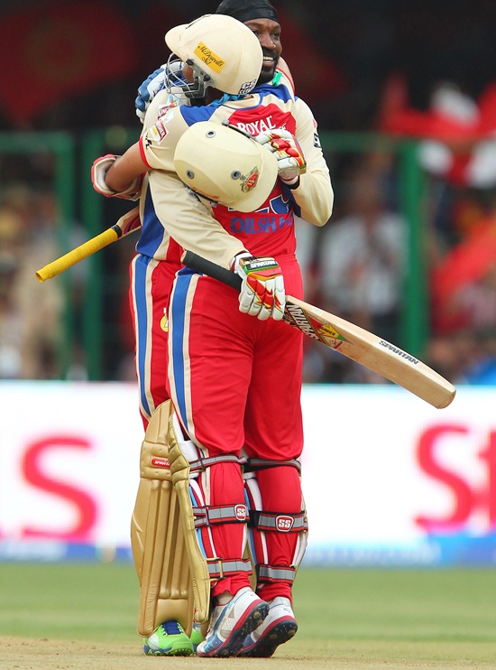 Chris Gayle celebrates with Tillakaratne Dilshan after getting to 150