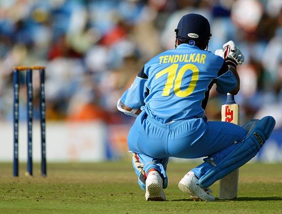 Sachin Tendulkar relaxes during a 1993 World Cup match; despite a leg injury, he scored 98 off 75 balls