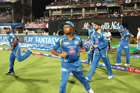 Rohit Sharma (left) leads Mumbai Indians on to the field
