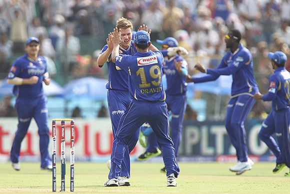 James Faulkner of Rajasthan Royals is congratulated by Rajasthan Royals captain Rahul Dravid on claiming a wicket