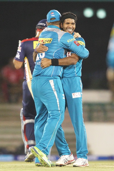 Ashok Dinda celebrates the wicket of Virender Sehwag