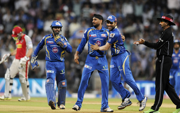 Harbhajan Singh and Rohit Sharma celebrate the fall of Gurkeerat Mann's wicket