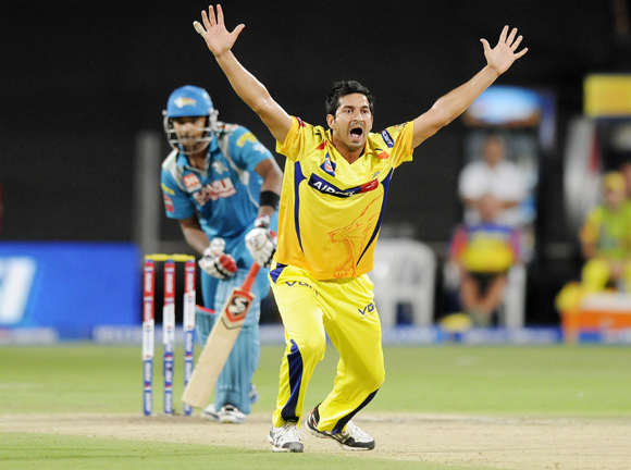 Chennai Super King player Mohit Sharma celebrates after getting the wicket of Pune Warriors player Aaron Finch