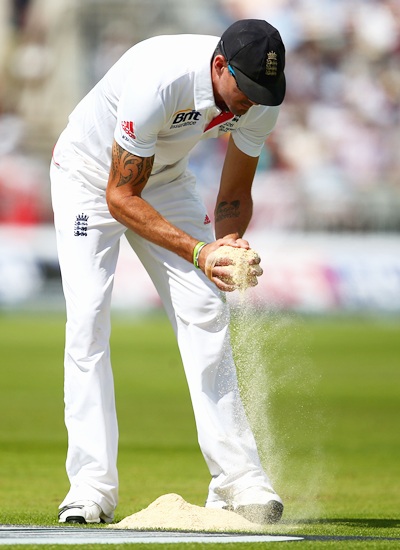 Kevin Pietersen of England collects saw dust for the bowlers' run-up