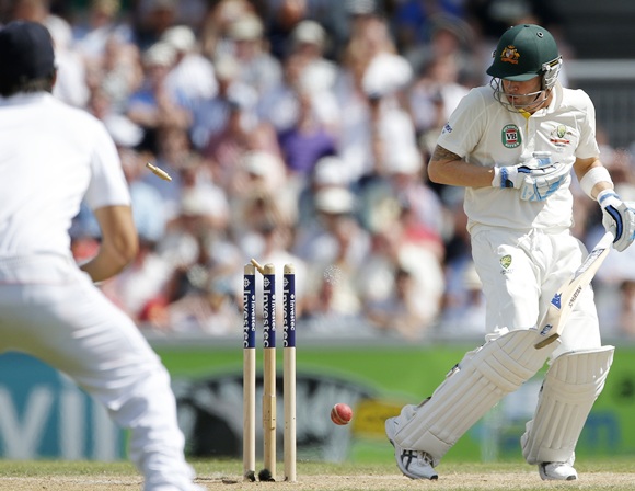 Australia's Michael Clarke reacts after being bowled by England's Stuart Broad