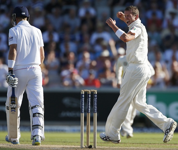 Australia's Peter Siddle (right) celebrates after dismissing England's Joe Root