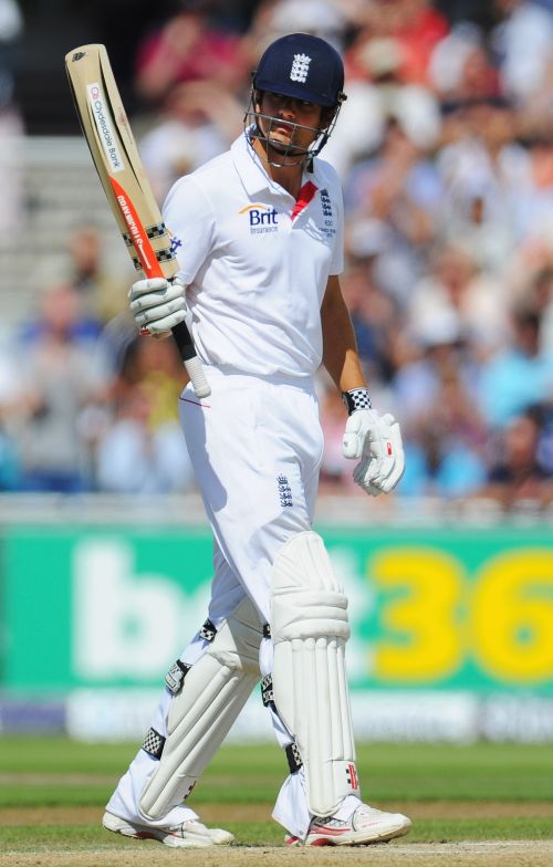 Alastair Cook celebrates after completing his half century