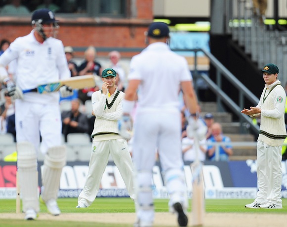 Michael Clarke of Australia looks on with Steve Smith (right) as Stuart Broad and Matt Prior of England pick up more runs
