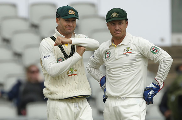 Australia's captain Michael Clarke (left) signals to review the umpires decision as he stands with Brad Haddin on the final day of the third Ashes Test