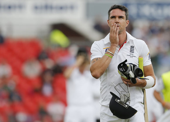 England's Kevin Pietersen walks off the pitch after being dismissed