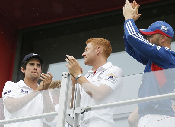 (From left) Alastair Cook, Jonny Bairstow and Matt Prior applaud the crowd from their balcony