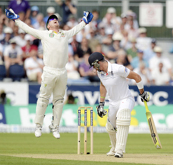 England's Kevin Pietersen edges the ball and is caught by Australia's Brad Haddin (left) on Day 1 of the 4th Ashes Test on Friday