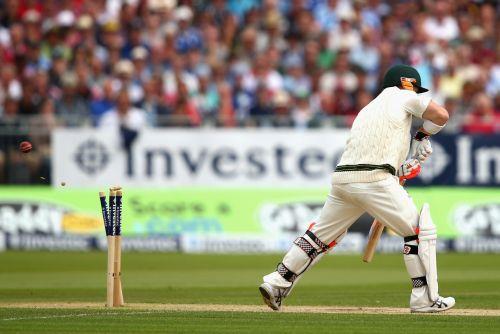 David Warner of Australia is bowled by Stuart Broad