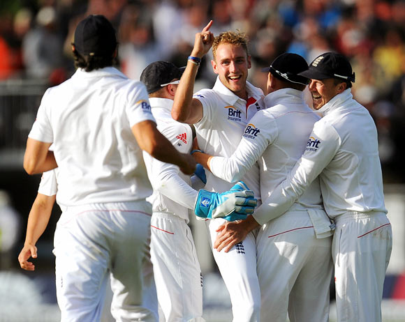 England bowler Stuart Broad celebrates with team mates after dismissing Brad Haddin