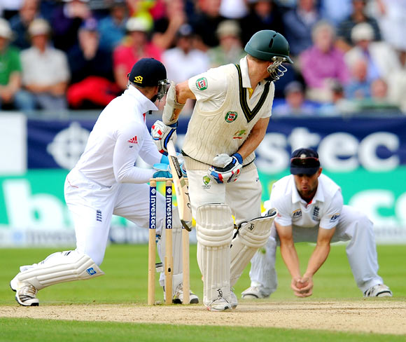 Chris Rogers is caught by Jonathan Trott off the bowling of Graeme Swann