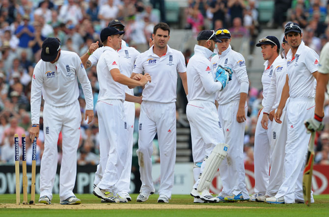 James Anderson of England celebrates the wicket of Peter Siddle of Australia with team mates