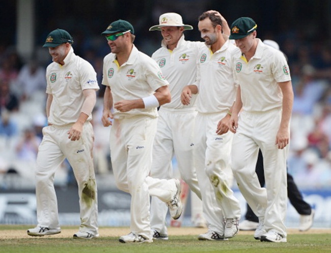 Australian players celebrate with Nathan Lyon after dismissing Joe Root