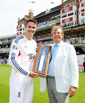 Kevin Pietersen of England receives a commemorative engraved bat from ECB Chairman Giles Clarke after becoming England's leading run-scorer in International Cricket
