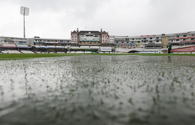  Puddles form on the pitch at the Oval in London