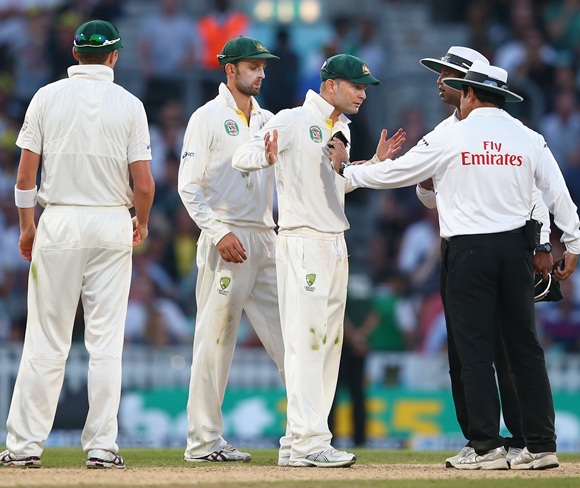 Michael Clarke of Australia remonstrates with Umpire Aleem Dar before bad light ended the match