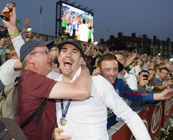 Kevin Pietersen of England celebrates with fans