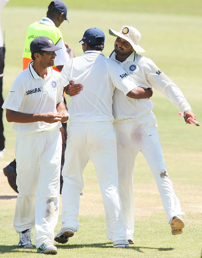 Rahul Dravid, left , Murali Vijay, centre, and Harbhajan Singh celebrate after defeating South Africa in the 2nd Test at the Sahara Stadium, Kingsmead, Durban, December 29, 2010.