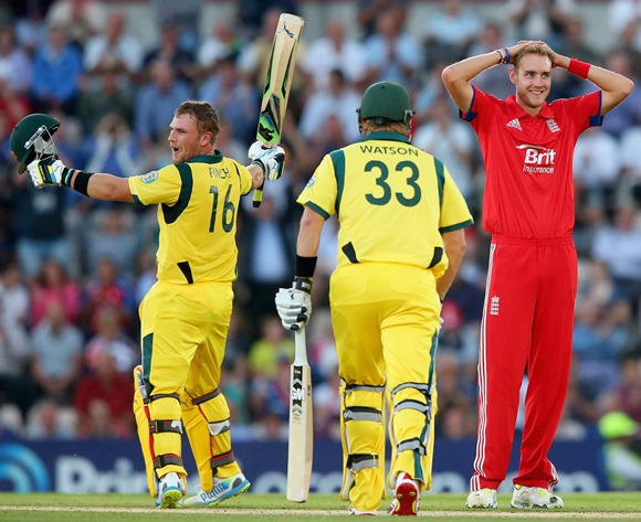 Aaron Finch of Australia celebrates his century as Stuart Broad of England looks on